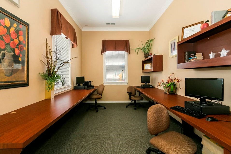 a home office with a desk and a computer
