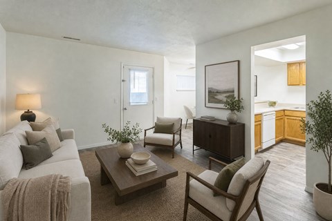 A living room with a couch, chair, and coffee table.