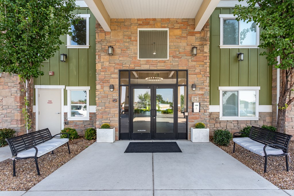 A building with a black door and a glass window above it.