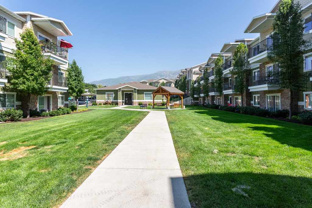 A sunny day at a residential complex with a clear blue sky.
