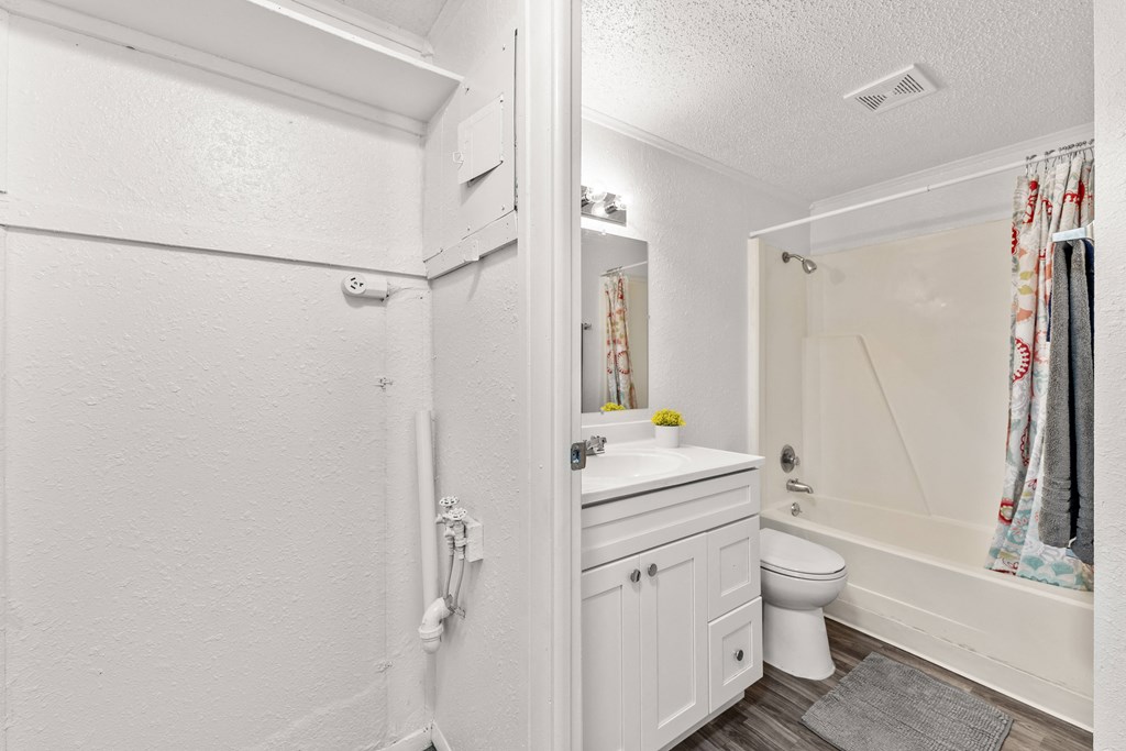 a bathroom with a sink toilet and a shower