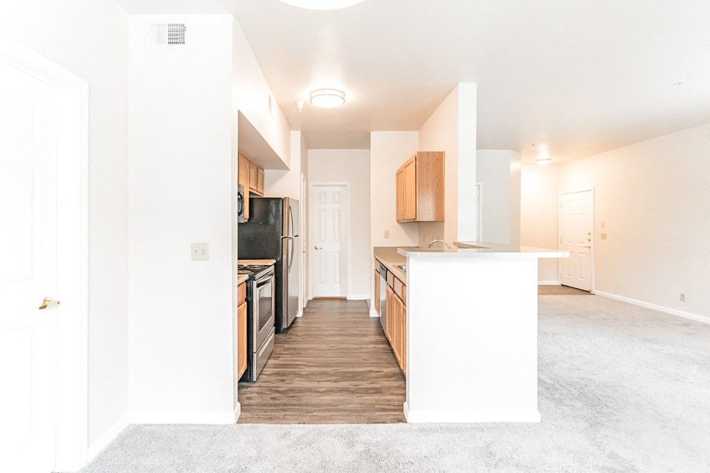 a kitchen and living room in a 555 waverly unit