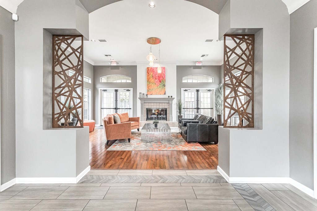 a living room with grey walls and a fireplace