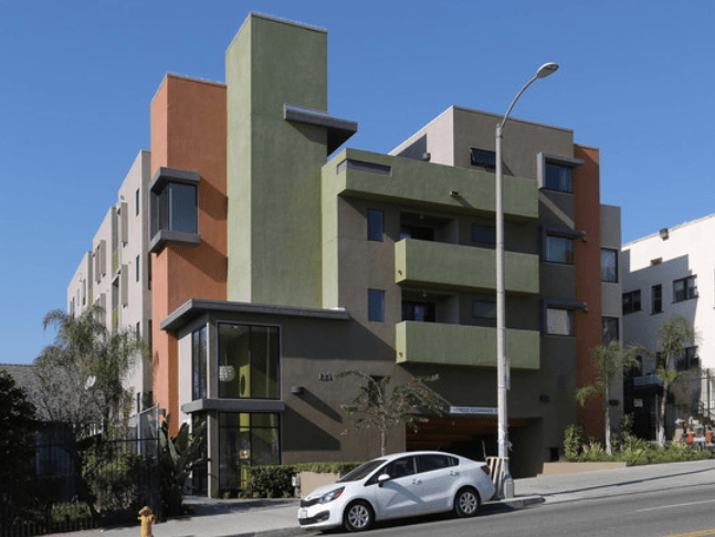 a car parked in front of a building on a city street