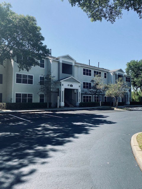a large building with a street in front of it
