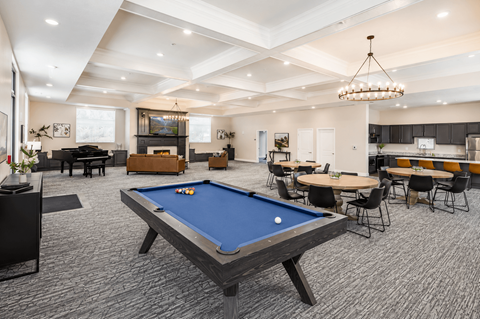 Spacious clubhouse with pool table and dining area at The Ellison Apartments, Utah