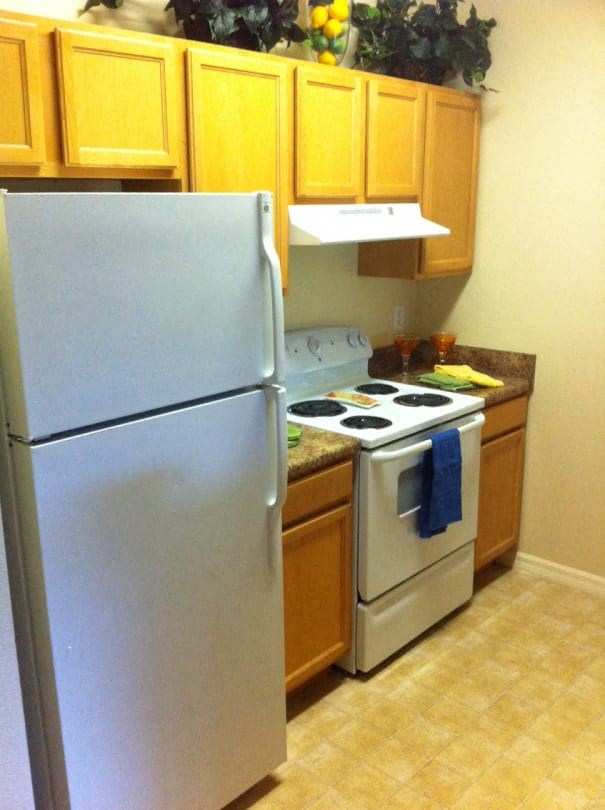 a kitchen with a stove and a refrigerator