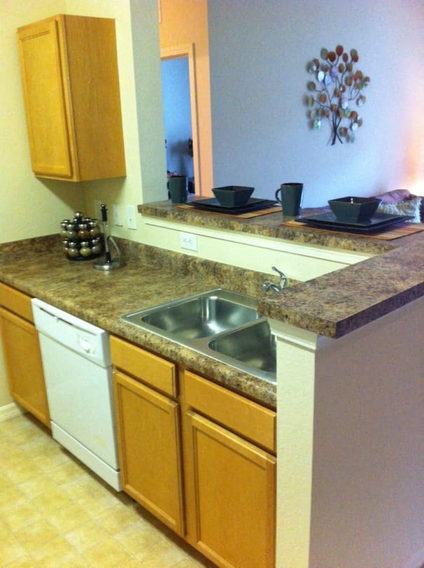 a kitchen with a sink and a counter top