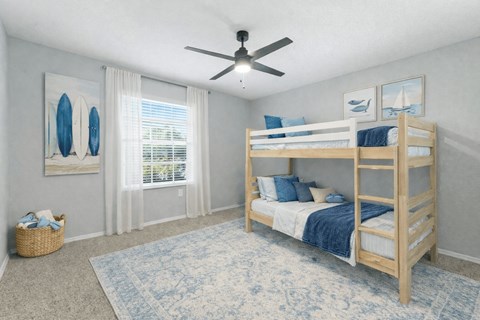 A bedroom with a bunk bed and a ceiling fan. at Waterbridge Apartments , Orlando, FL, 32837