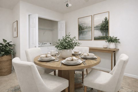 A dining room with a round table set for four.