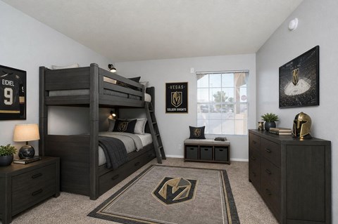 A bedroom with a bunk bed and a rug with a lightning bolt design.