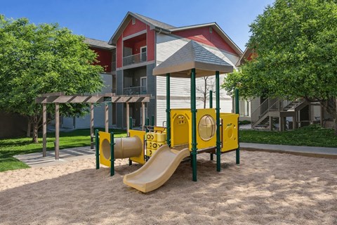 Playground with slide and tunnel in courtyard at Stetson Meadows Apartments, Colorado, 80922