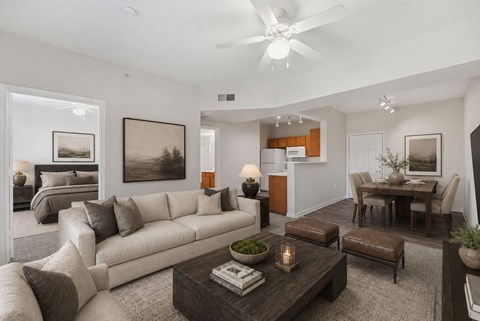 A modern living room with a large couch and a coffee table.