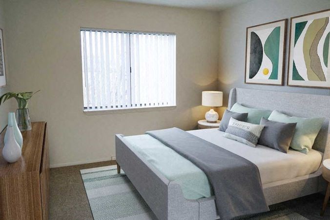 a bedroom with a bed and pictures on the wall