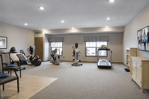 Fitness center with cardio and strength equipment at The Estates at Arbor Oaks Apartments, Minnesota