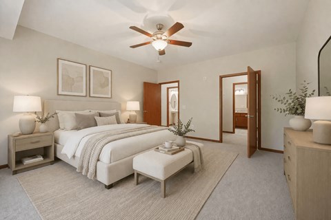 Primary bedroom with en suite bathroom access at The Estates at Arbor Oaks Apartments, Andover, MN 55304