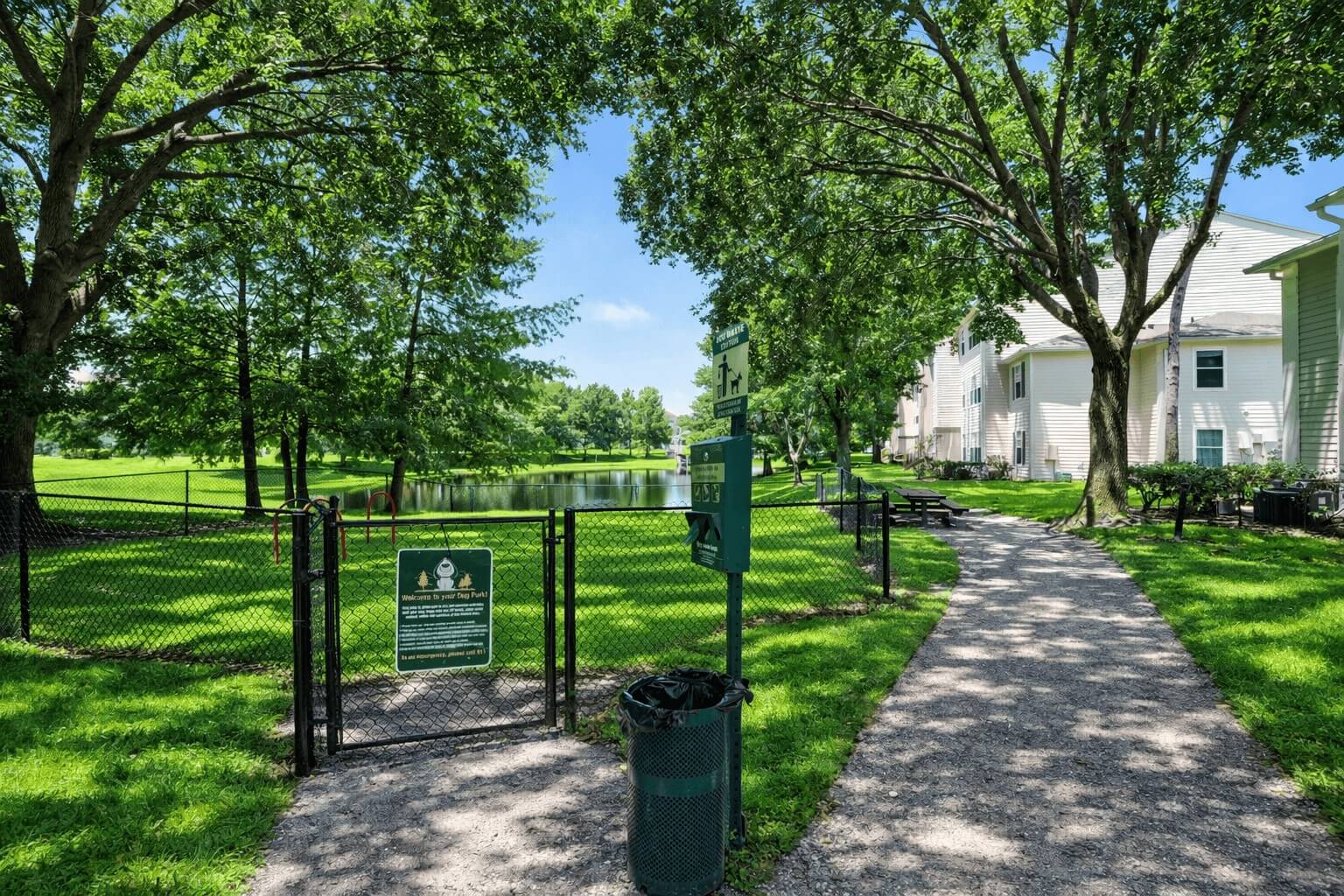 A sign in a park with a green background and white text.