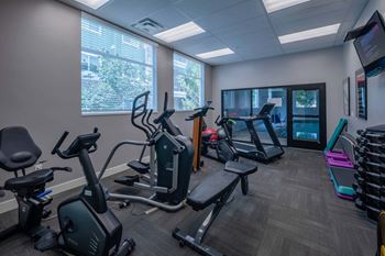 a gym with various exercise machines and a large window The Beckstead, South Jordan, UT, 84095