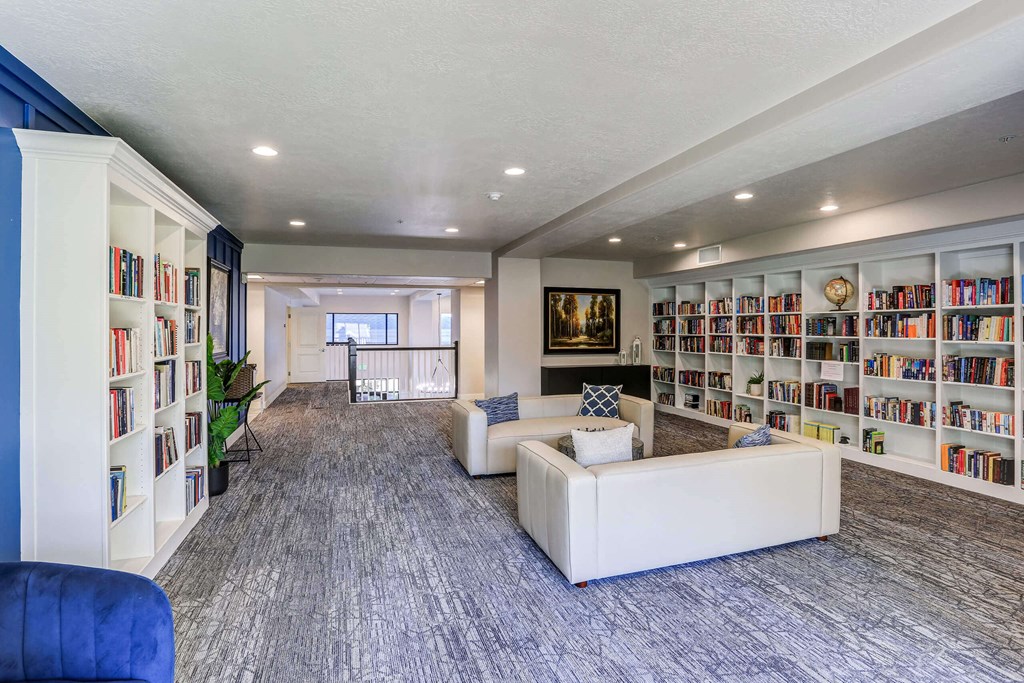 a large room with couches and bookshelves at The Beckstead, Utah, 84095