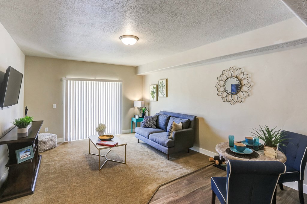 a living room with a couch chair and coffee table at The Beckstead, Utah