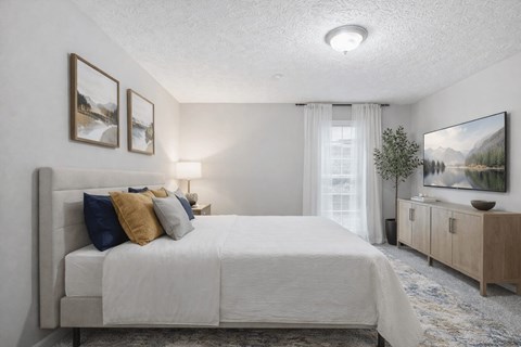 Bedroom with neutral decor and natural light at Linden Ridge Apartments, Stone Mountain, 30083