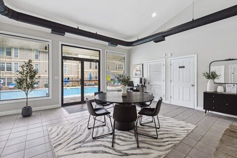 Community clubhouse with pool view at Linden Ridge Apartments, Stone Mountain, GA
