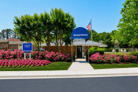 The Morrowood sign is blue and white with an American flag on it.