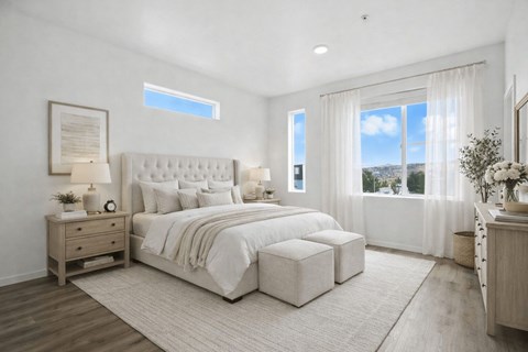 Bright bedroom with neutral tones and large windows at Summit Ridge Townhomes Apartments, Reno