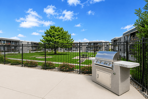 Outdoor grilling with courtyard view at Park Station Apartments, Midvale, UT 84047