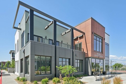 A modern building with a glass facade and a red brick section labeled "LEADERSHIP CENTER".