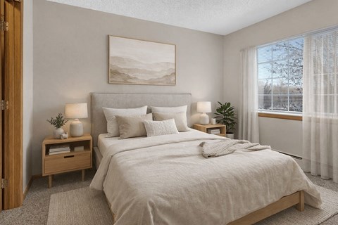 Cozy bedroom with neutral tones and natural light at Grand Gateway Apartments, St Cloud