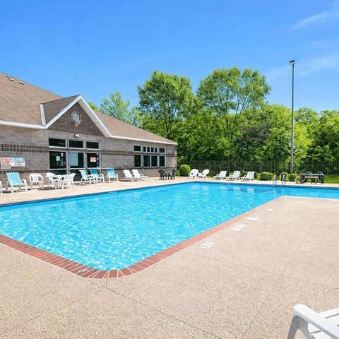 Outdoor swimming pool with poolhouse and sundeck at Regency Park Apartments, St Cloud, MN 56304