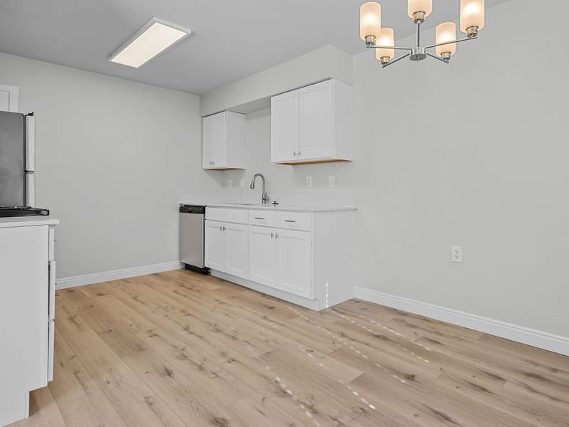 kitchen with white cabinets at Lexington Park Apartments, West Valley City Utah
