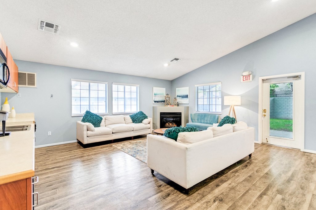 a living room with couches and a fireplace