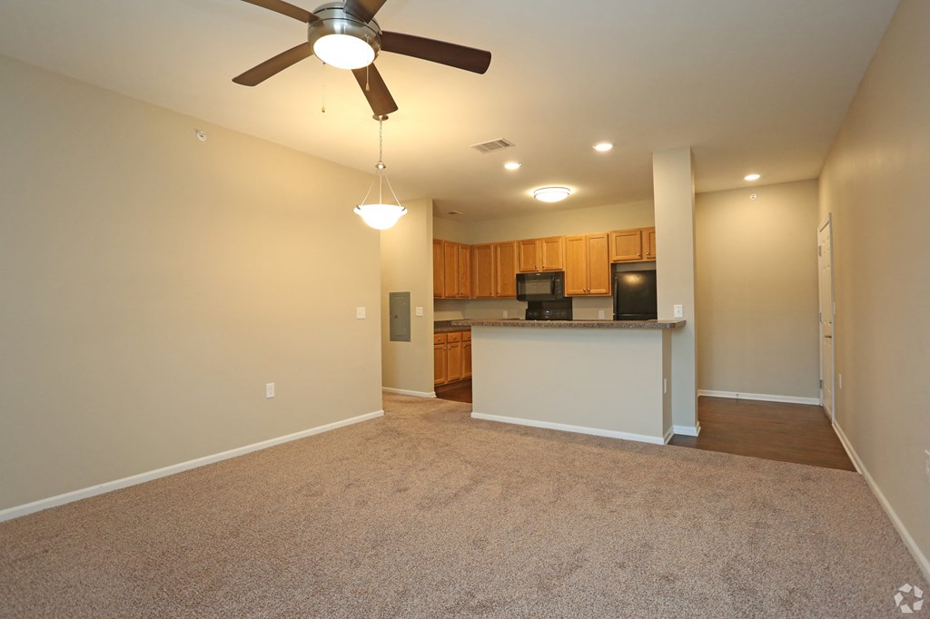 living room with a ceiling fan and view of the kitchen at The Wilshire, Lake Charles, LA, 70607