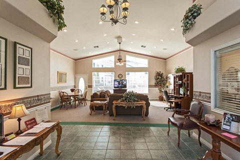 a living room filled with furniture and a large window