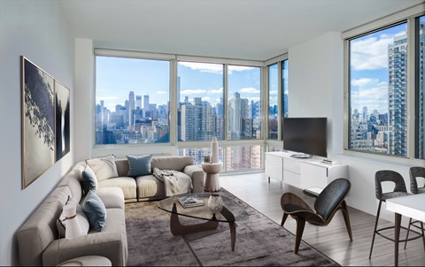 A living room with a couch, chairs, and a coffee table.