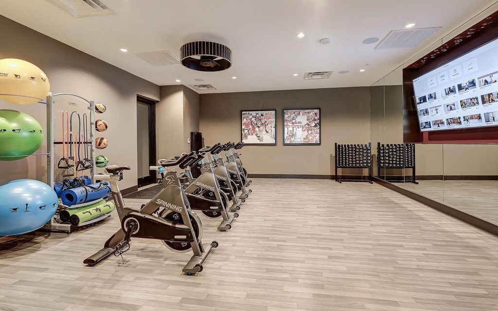 Oversized Fitness Center with Flex Studio featuring Spin Bikes and Stability Balls