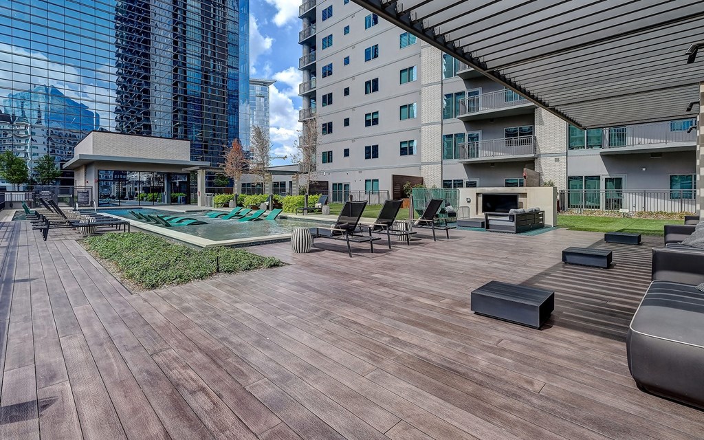 Resort Style Swimming Pool with Cabanas,  Lounge Spaces, and City Views
