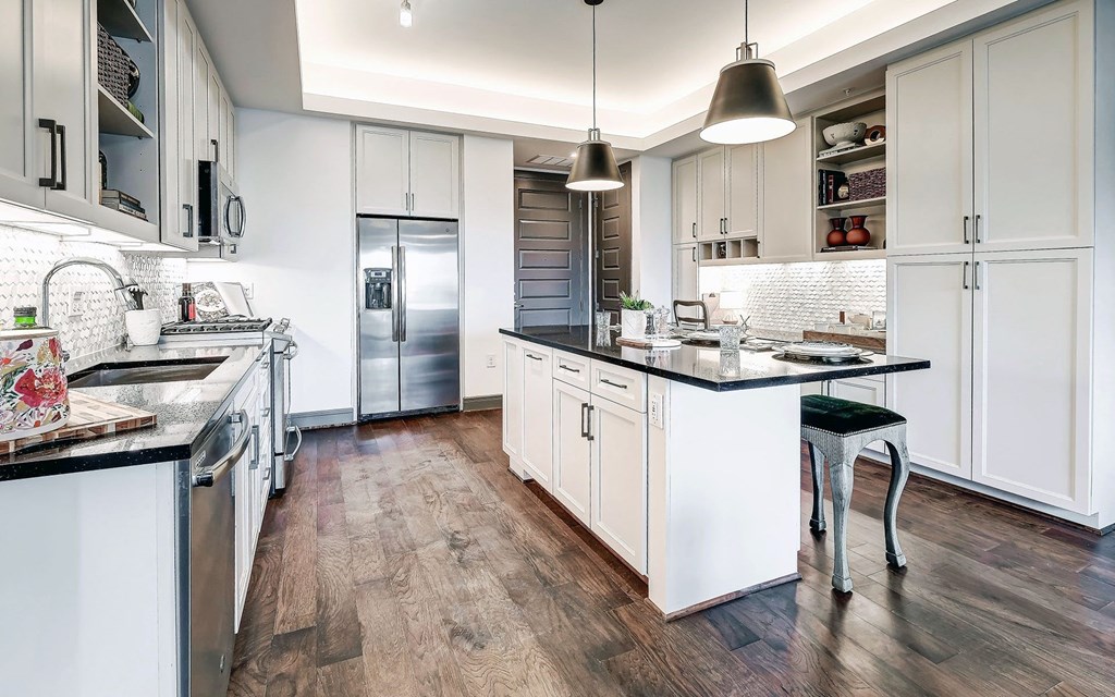 Custom Model Kitchen with Dine-In Gourmet Kitchen Islands, Stainless Steel Appliances, and Gas Ranges Stoves