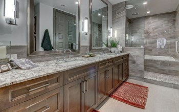 The Christopher at The Union | Luxury Apartments in Dallas, TX Crafted Tubs with with Tiled Fronts and Walk-in Showers and Built-In Showers with Bench in Select Apartment Homes - Photo Gallery 6