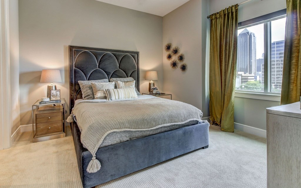 Spacious Model Bedroom with Carpeted Flooring and Natural Light