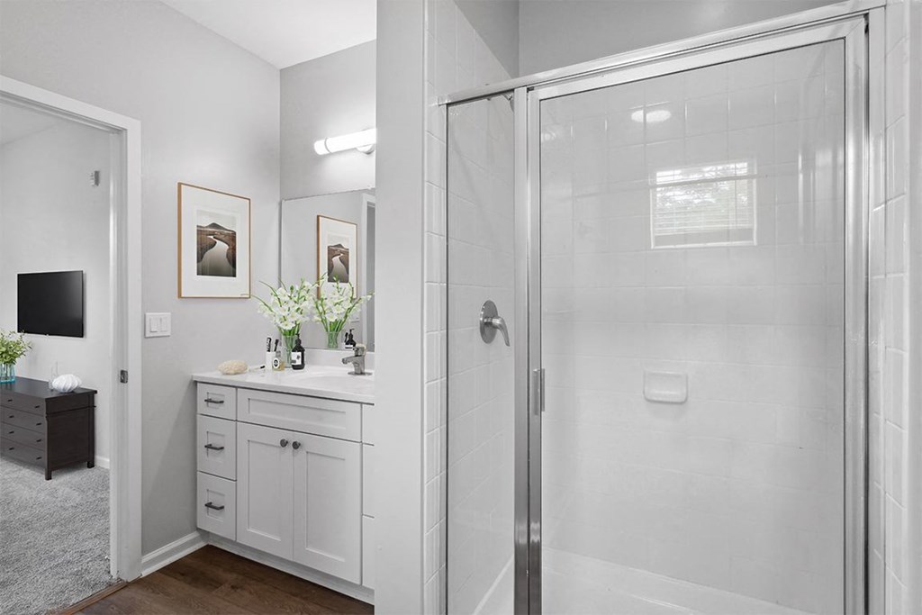 a bathroom with a shower and a sink at Two Addison Place, Apartments Georgia, 31322