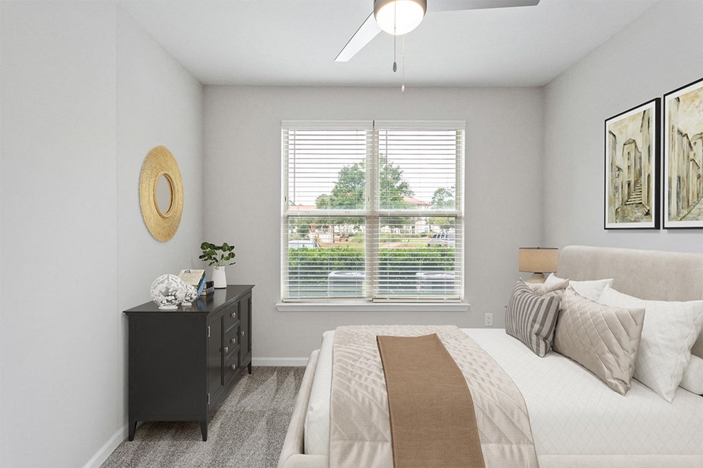 a bedroom with a large window and a ceiling fan at Two Addison Place Apartments, Pooler, GA, 31322