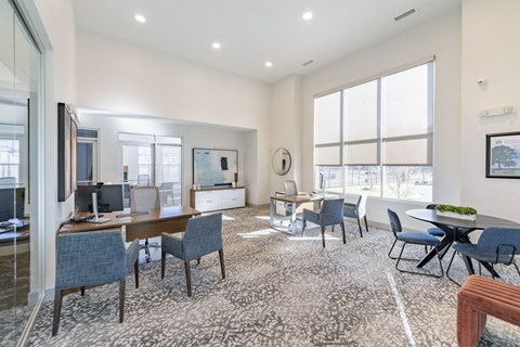 a living room with a large window and a table and chairs at Sycamore at Tyvola, Charlotte, NC, 28217