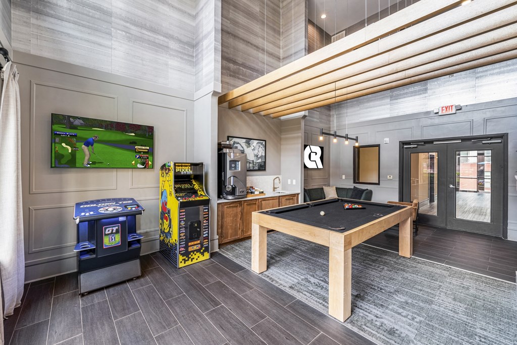 a game room with a pool table and video games and a television  at Park and Kingston, Charlotte, NC, 28203