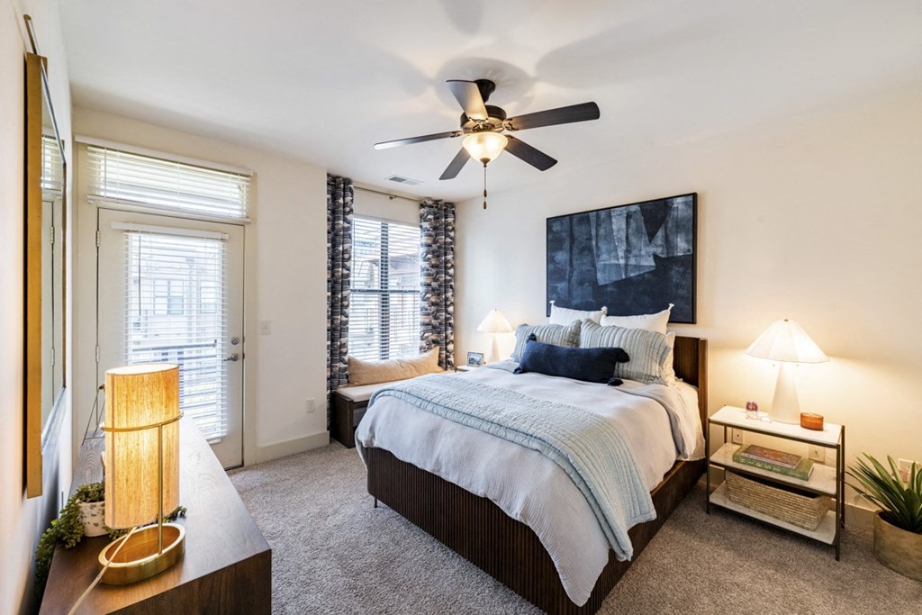 a bedroom with a large bed and a ceiling fan at Park and Kingston, Charlotte, North Carolina