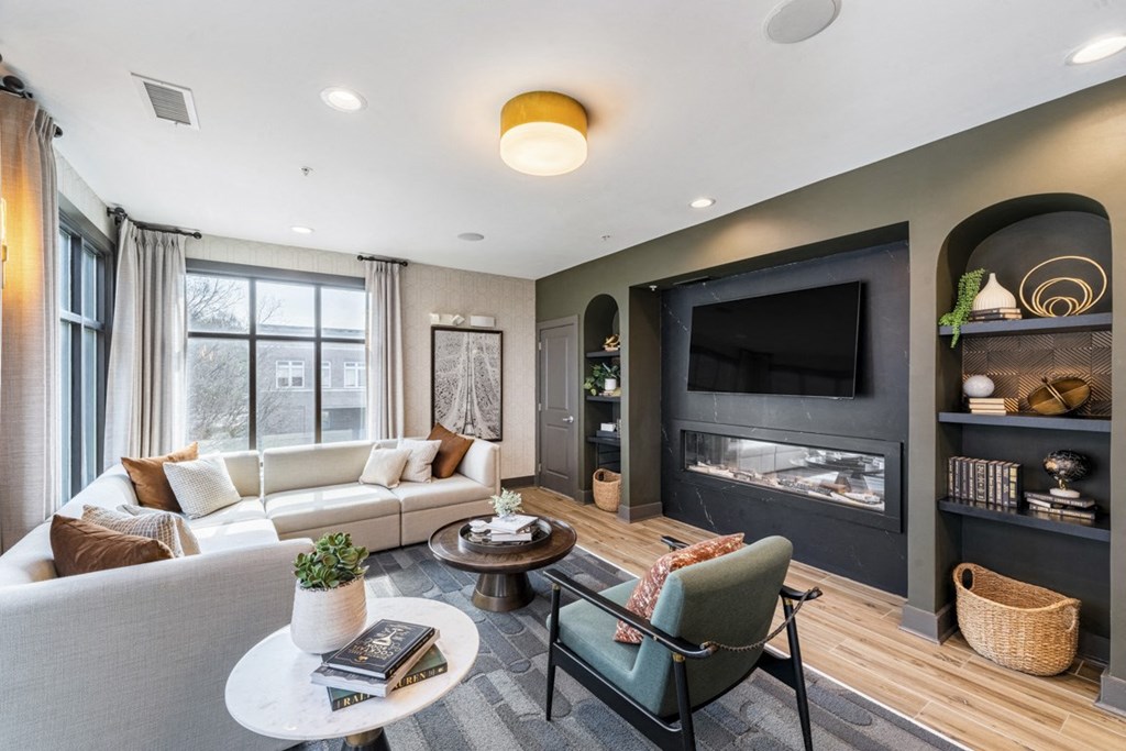 a living room with a couch and a tv at Park and Kingston, North Carolina, 28203