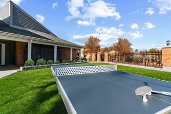 Outdoor ping pong table with building in background  at Westwinds Apartments, Annapolis MD