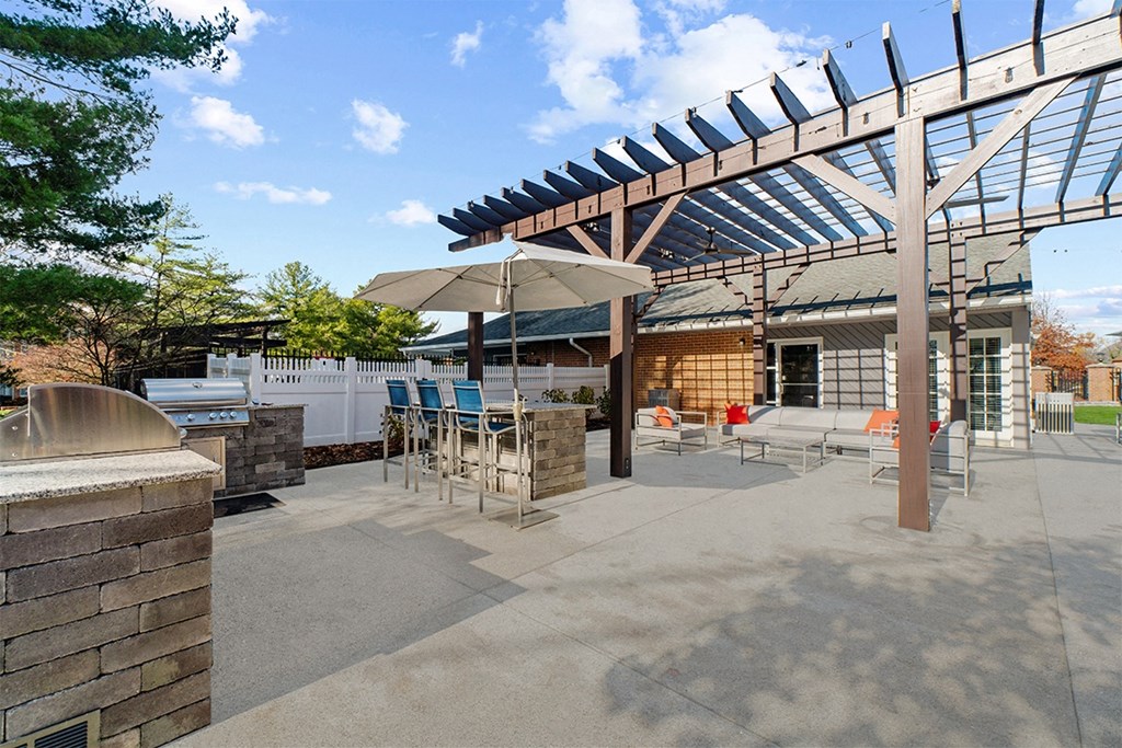 Outdoor kitchen with grilling stations and seating at Westwinds Apartments, Annapolis MD